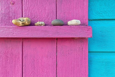 Four discarded stones on a beam