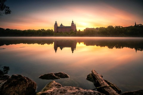 Johannisburg Castle reflected in the Main River