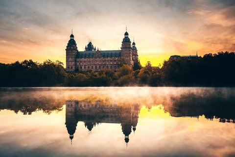 Johannisburg Castle reflected in the Main River