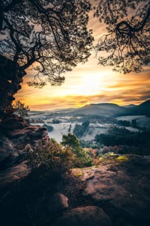 View from the sandstone rock Wachtfelsen to the sunrise