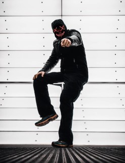 Man with Purge mask pointing finger