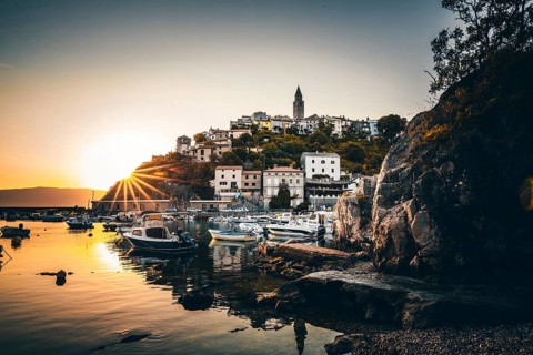 Historical village by the sea. Bay with harbour in the morning