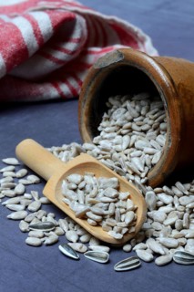 Peeled sunflower seeds in pots and scoops