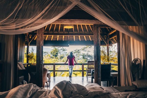View from a four-poster bed into the morning atmosphere