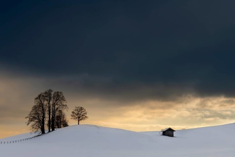 Winter landscape against a dramatic sky