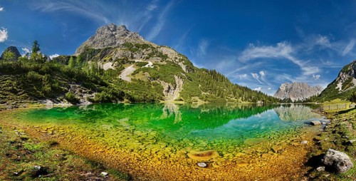 Mountain panorama at the turquoise Seebensee with the mountain peaks of the Sonnenspitze and the Wetterstein massif with reflection