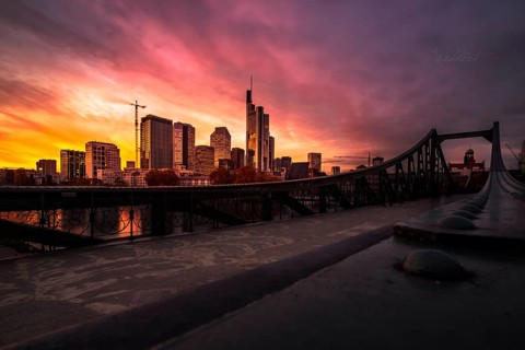 View over the Eiserner Steg with the skyline of Frankfurt am Main