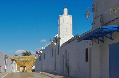 Empty street with tower and city wall