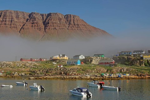 Cloud wall and some multicoloured wooden houses