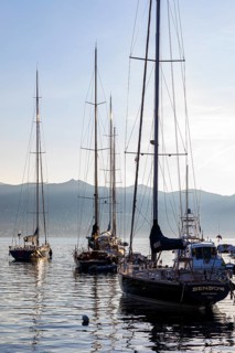 Sailing yachts anchored in the morning light in Portofino harbour