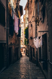 Laundry drying on the line in an alley in the old town