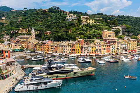 Luxury yachts anchor in the harbour of Portofino