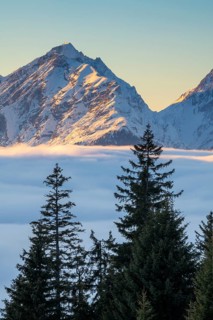 Winter mountain landscape with closed fog cover over the Inn valley