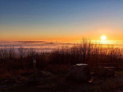 Sunset over cloud cover on mountain top