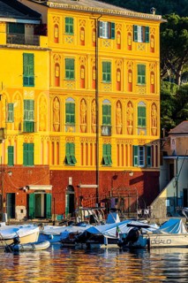 Historic house facade in the morning light in Portofino harbour