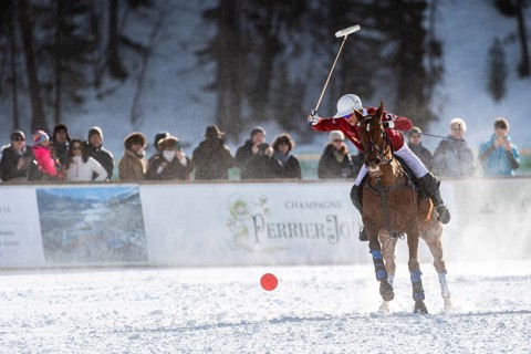 Robert Strom of Team St. Moritz hits the ball