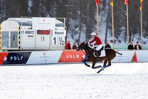 Robert Strom of Team St. Moritz rides across the field in full gallop