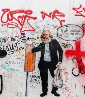 Karl Marx caricature on the wall of the East Side Gallery
