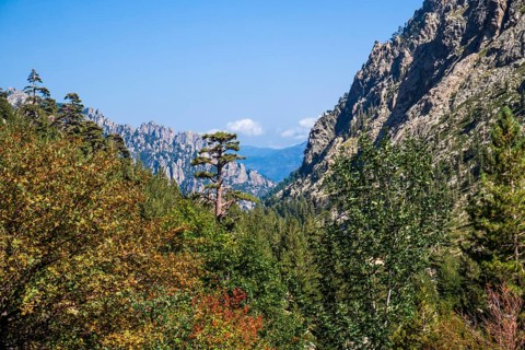 Hiking to the mountain lake Lac de Melo