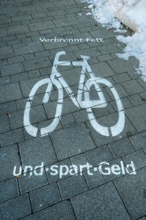 Patch with bicycle symbol and saying 'burns fat and saves money'