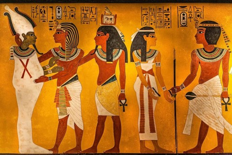 King Tutankhamun embraces the god of the dead Osiris