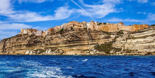 Steep coast of Bonifacio with old town on a limestone plateau