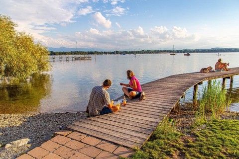 Man and woman sitting on the jetty