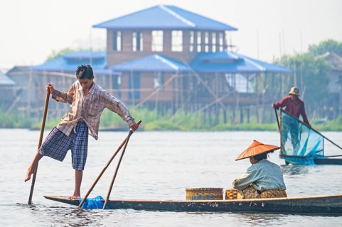 Fishermen with fish trap and nets
