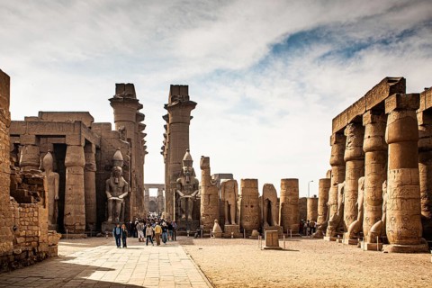 South doorway to the Great Colonnade with colossal statues of Ramses II. Luxor Temple