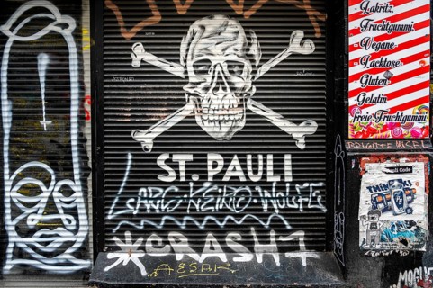 Graffiti on the blinds of a shop in the Karolinenviertel