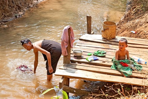 Washing clothes on the banks of the Nam Pilu River