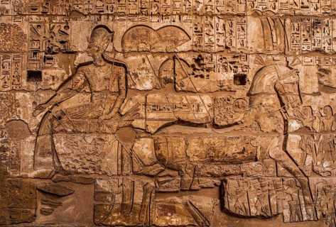 In front of Ramses III in the chariot