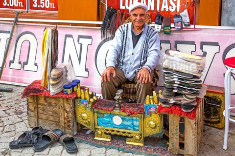 Shoeshine boy at the Hacibayram Mosque