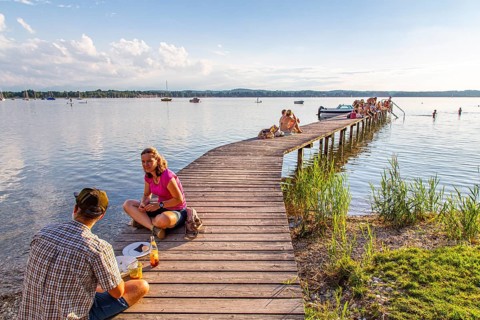 Man and woman sitting on the jetty