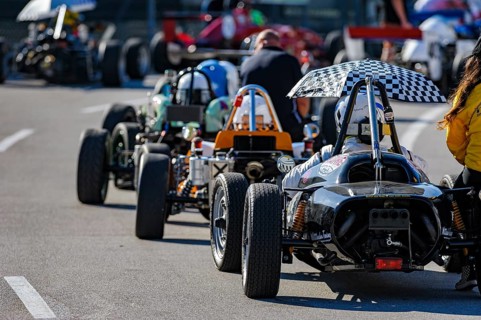 Historic race cars in waiting position