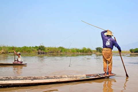 Fishermen with fish trap and nets