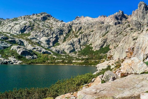 Hiking to the mountain lake Lac de Melo