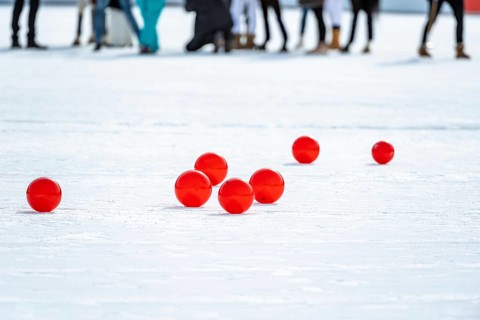 Red polo balls on the field