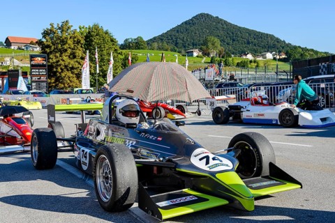 Historic race cars in waiting position