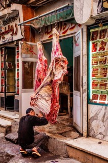Butcher's shop next to gold jewellery shop