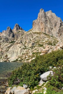 Hiking to the mountain lake Lac de Melo