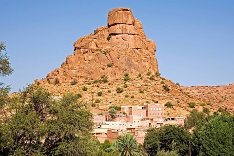 Village in front of bizarre granite rocks