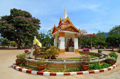 Spiritual Buddhist ghost house Ghost house in centre of roundabout in village