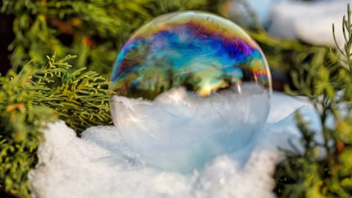 Freezing soap bubble on snow