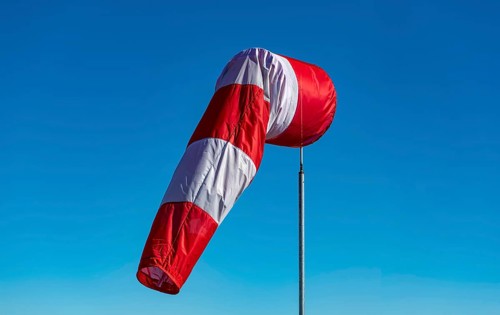 A windsock hangs on a mast at Munich Airport