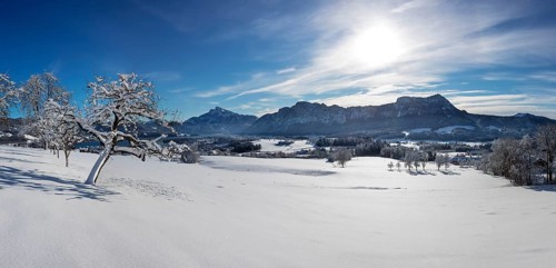 View of snow-covered Mondseeland with Schafberg and Drachenwand