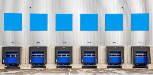 6 blue loading ramps at warehouse