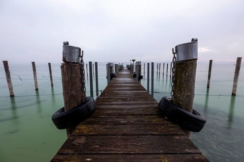 Empty shipping pier in autumn rain