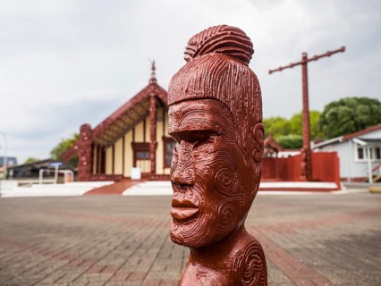 Wooden figure at the Maori meeting house in Ohinemutu
