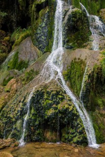 Waterfall and moss-covered rocks
